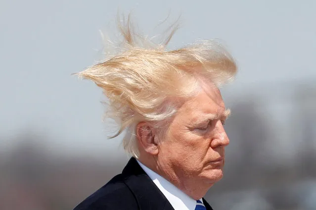 U.S. President Donald Trump boards Air Force One on a windy day at Joint Base Andrews, Maryland before departing en route West Virginia, U.S., April 5, 2018. (Photo by Kevin Lamarque/Reuters)