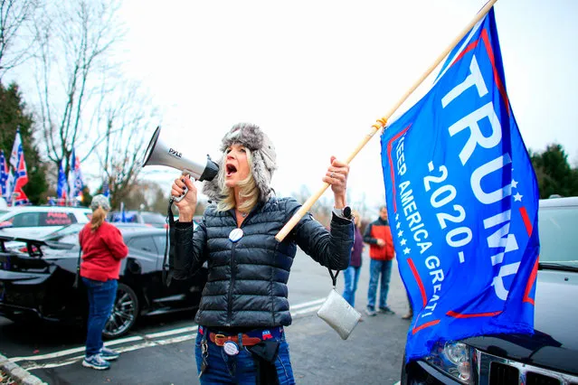 A woman shouts slogans as Trump Supporters gather during a car rally named as “Stop the Steal” on November 22, 2020 in Long Valley, New Jersey. (Photo by Kena Betancur/AFP Photo)