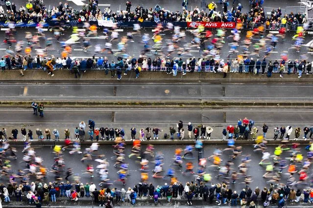 Athletes run across the Erasmus Bridge during the 42nd edition of the NN Marathon Rotterdam in Rotterdam, the Netherlands, 16 April 2023. (Photo by Jeffrey Groeneweg/EPA)
