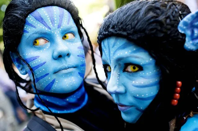 Revelers dressed as Neytiri from the movie “Avatar” participate in the Carnival Of Cultures parade in Berlin, on May 19, 2013. (Photo by Gero Breloer/Associated Press)