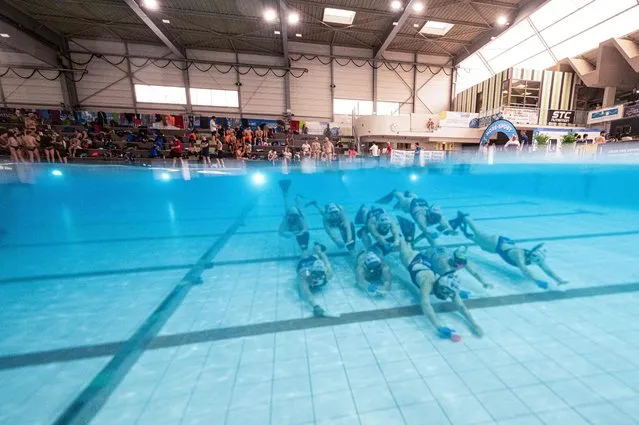 The French world champion women's Underwater Hockey Masters team take part in a training session before a friendly competition ahead of the upcoming World Championships in Sarcelles, outside Paris, on April 22, 2023. The 17th underwater Hockey Elite and Masters World Championship will take place in Australia from July 18 to 30, 2023. (Photo by Anne-Christine Poujoulat/AFP Photo)