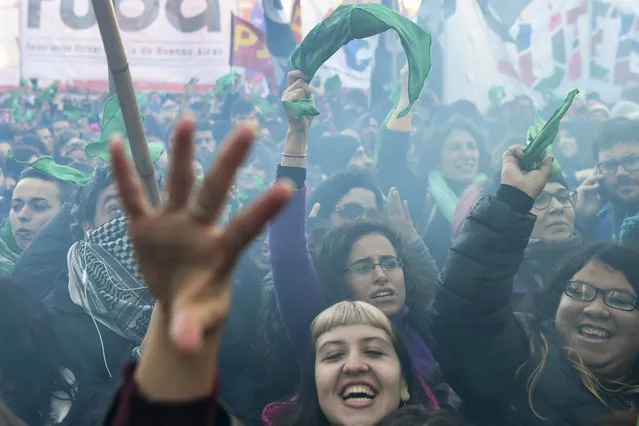 Pro-choice activists react outside the Argentine Congress in Buenos Aires, on June 14, 2018, shortly after lawmakers approved a bill to legalize abortion. 
Lawmakers in Pope Francis' native Argentina on Thursday narrowly approved a bill to legalize abortion during the first 14 weeks of pregnancy. The lower house Chamber of Deputies passed the bill by 129 votes to 125. The bill now goes before the Senate. (Photo by Eitan Abramovich/AFP Photo)