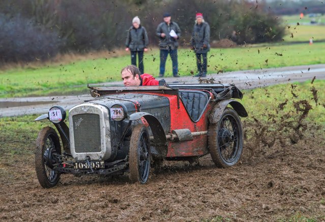 Competitors taking part in Saturday's Winter Driving Tests meeting organised by the Vintage Sports Car Club at Bicester Heritage in Oxfordshire, UK on November 29, 2025. They faced a variety of tests set out around the perimeter of the airfield with heavy overnight and morning rain making the going tricky and very muddy. (Photo by Paul Jacobs/Picture Exclusive)