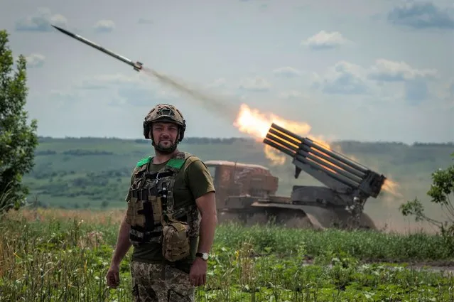 A Ukrainian MSLR BM-21 “Grad” fires towards Russian positions, near Bakhmut at the frontline in Donetsk region, Ukraine, Wednesday, June 21, 2023. (Photo by Iryna Rybakova via AP Photo)