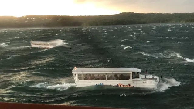 An image from video shows two duck boats on Table Rock Lake near Branson, Mo., during a thunderstorm Thursday, July 19, 2018. A duck boat with 29 passengers and a two-member crew sank during the storm, with 17 deaths confirmed by authorities. (Photo by Trent Behr/The Washington Post)