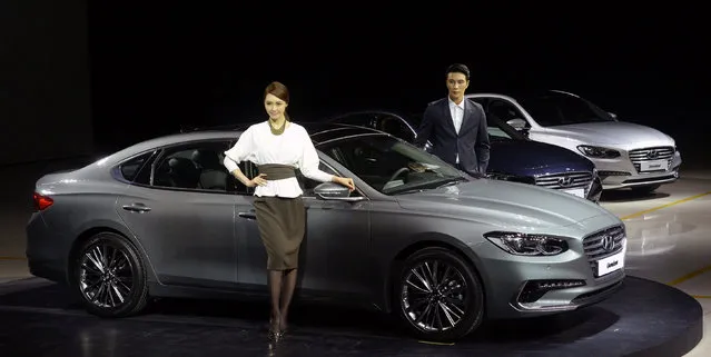 Models pose with Hyundai Motor's large sedan Grandeur IG, also known as Azera, during its unveiling event in Gimpo, South Korea, November 22, 2016. (Photo by Hwang Ki-seon/Reuters/News1)