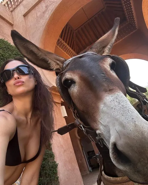 Russian model Irina Shayk enjoys the Red city with a four-legged friend in the second decade of July 2023. (Photo by irinashayk/Instagram)