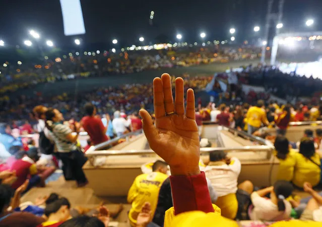 Tens of thousands of Catholic attend a mass prior to a procession of the image of the Black Nazarene in celebration of its feast day in Manila, Philippines, Saturday, January 9, 2016. (Photo by Bullit Marquez/AP Photo)