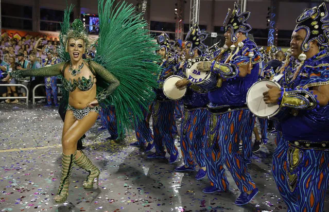 A dancer from the Vila Maria samba school performs during a carnival parade in Sao Paulo, Brazil, Saturday, February 14, 2015. (Photo by Andre Penner/AP Photo)