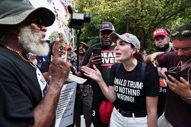 Laura Loomer, far-right activist, speaks with anti-Trump demonstrators near the entrance of the Fulton County Jail, as former U.S. President Donald Trump is expected to turn himself in to be processed after his Georgia indictment, in Atlanta, Georgia, U.S., August 24, 2023. (Photo by Dustin Chambers/Reuters)