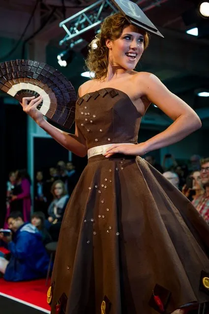 London, United Kingdom. 18th October 2013. A model showcases a chocolate dress at the London Chocolat Fashion show 2013.  Salon du Chocolat, the world's largest chocolate show comes to London. This spectacular finish to a wonderful line up of Chocolate Week activities takes place from 18th-20th October at National Hall, Olympia. (Photo by Anastasia Mishchenko/Demotix Photojournalist)