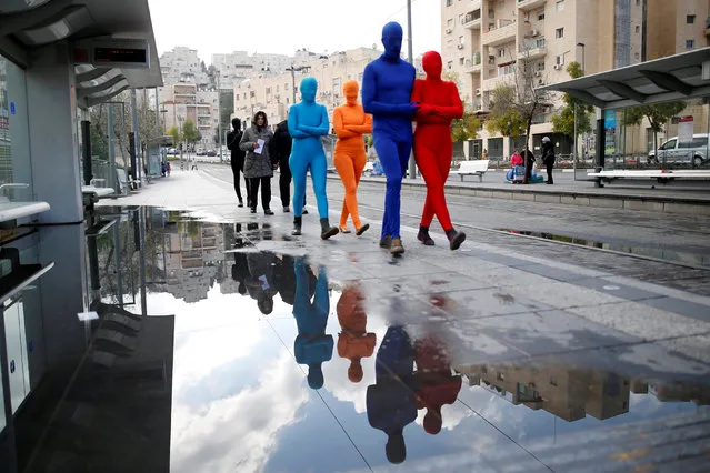 Members of the Prizma Ensemble wearing full solid-coloured bodysuits take part in a festival for the Jewish holiday of Hanukkah, in Jerusalem December 26, 2016. (Photo by Amir Cohen/Reuters)