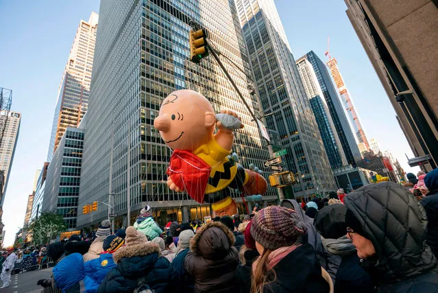 Charlie Brown float over the crowd during the 92nd Annual Macy's Thanksgiving Day Parade on November 22, 2018, in New York. (Photo by Don Emmert/AFP Photo)