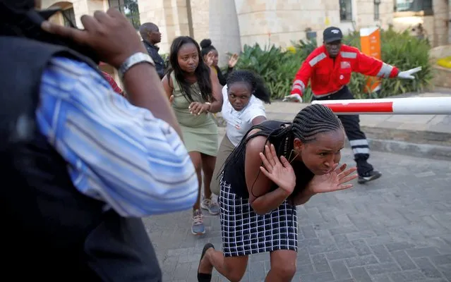 People run as they are evacuated at the scene where explosions and gunshots were heard at the Dusit hotel compound, in Nairobi, Kenya on January 15, 2019. (Photo by Thomas Mukoya/Reuters)