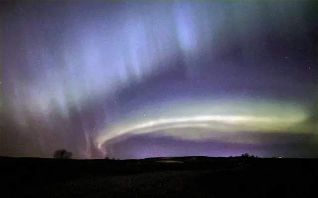 The night sky in North Dakota is bursting with colors early Monday, April 24, 2023, with a memorable display of northern lights near Cross Ranch State Park along highway 1806, about 34 miles north of Bismarck, N.D. (Photo by AP Photo)