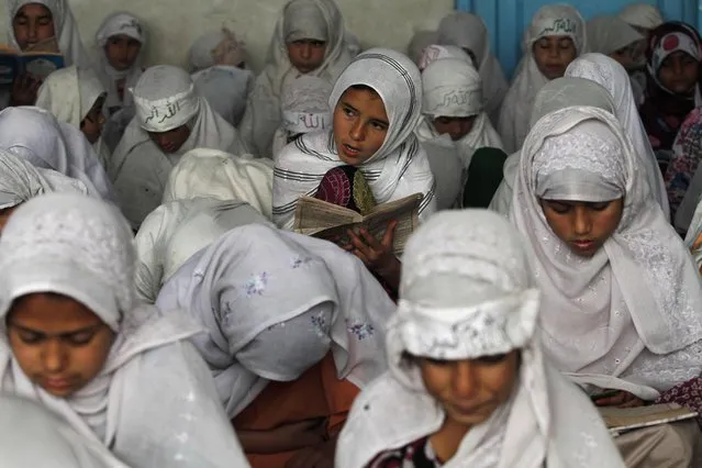 Afghan Muslim girls read the Quran, Islam's holy book, at a mosque in Kandahar south of Kabul, Afghanistan, Wednesday, March 2, 2016. (Photo by Allauddin Khan/AP Photo)