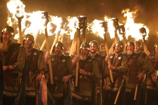 The Jarl Squad set light to the galley in Lerwick on the Shetland Isles during the Up Helly Aa fire festival on Tuesday, January 30, 2024. Originating in the 1880s, the festival celebrates Shetland's Norse heritage. (Photo by Andrew Milligan/PA Images via Getty Images)