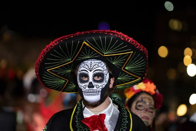 A Halloween reveler dressed in costume participates in New York City's 48th annual Greenwich Village Halloween Parade, Sunday, October 31, 2021, in New York. (Photo by Dieu-Nalio Chery/AP Photo)
