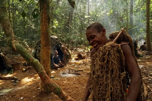 Baka man prepares to go hunting with his net in, Sangha Forest, Central African Republic, February 2016. (Photo by Susan Schulman/Barcroft Images)