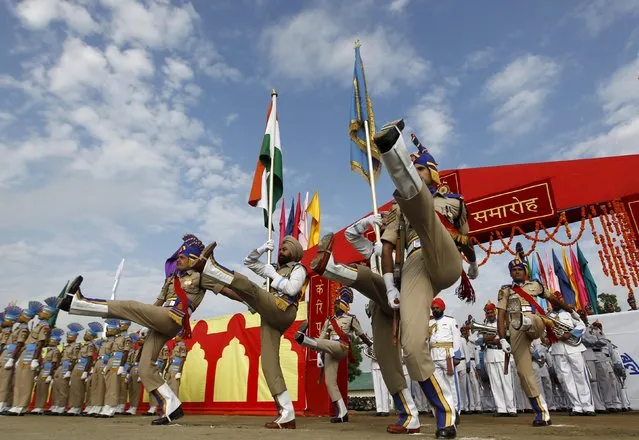 India's Central Reserve Police Force (CRPF) personnel take part in their passing out parade in Humhama, on the outskirts of Srinagar, May 14, 2015. A total of 341 new policemen were formally inducted into the force after they completed a 44-week training course and will be deployed in different parts of India, a CRPF official said. (Photo by Danish Ismail /Reuters)