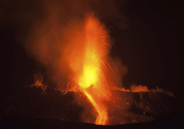 Mount Etna, Europe's most active volcano, spews lava during an eruption, near the Sicilian town of Catania, southern Italy, early Tuesday, February 28, 2017. The eruption was not dangerous and the airport of Catania is still open and fully operating. (Photo by Salvatore Allegra/AP Photo)
