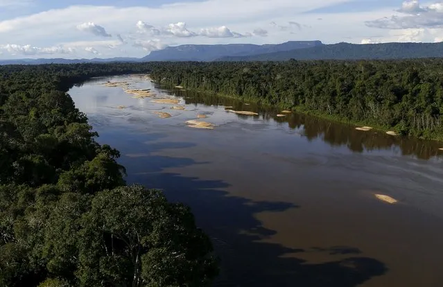 Uraricoera River is seen during Brazil’s environmental agency operation against illegal gold mining on indigenous land, in the heart of the Amazon rainforest, in Roraima state, Brazil April 15, 2016. (Photo by Bruno Kelly/Reuters)