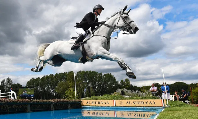 Anthony Condon of Ireland and Zira clear the water jump during the Longines BHS King George V Gold Cup at the Hickstead All England Jumping Course – International Arena on July 28, 2019 in Hickstead, West Sussex. (Photo by Mike Hewitt/Getty Images)