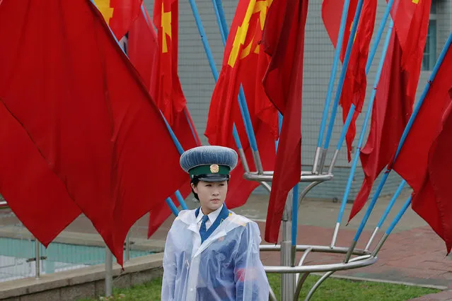 A policewoman controls the traffic near the venue of the Workers' Party of Korea (WPK) congress in Pyongyang, North Korea May 6, 2016. (Photo by Damir Sagolj/Reuters)