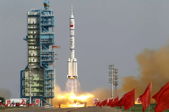 In this June 16, 2012, file photo, the Shenzhou 9 spacecraft rocket launches from the Jiuquan Satellite Launch Center in Jiuquan, China. State media say China is developing an advanced new spaceship capable of both flying in low-Earth orbit and landing on the moon. The newspaper Science and Technology Daily cited spaceship engineer Zhang Bainian as saying the new craft would be recoverable and have room for multiple astronauts. (Photo by Ng Han Guan/AP Photo)