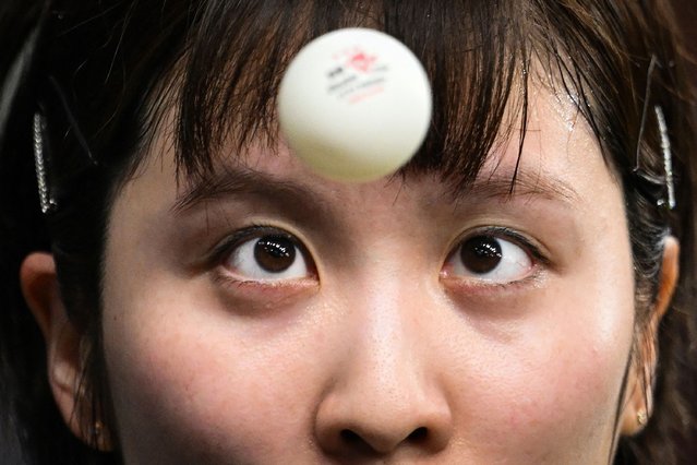 Japan's Miu Hirano eyes the ball as she prepares to serve to Italy's Giorgia Piccolin during their women's table tennis singles round of 64 at the Paris 2024 Olympic Games at the South Paris Arena in Paris on July 29, 2024. (Photo by Jung Yeon-Je/AFP Photo)