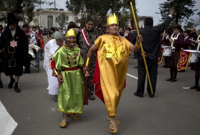 Patients from the Larco Herrera Psychiatric Hospital wear costumes in the likeness of the first governor and founder of the Inca civilization, Manco Capac, right, and his wife Mama Ocllo, during the hospital's Independence Day parade in Lima, Peru, Wednesday, July 22, 2015. (Photo by Martin Mejia/AP Photo)