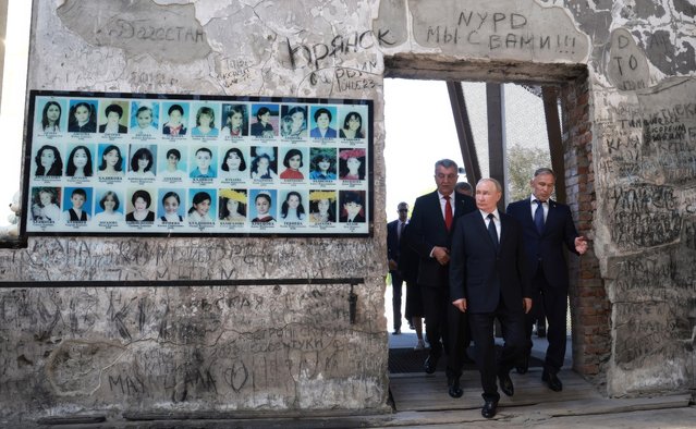 Russian President Vladimir Putin, center, accompanied by North Ossetia-Alania Head Sergei Menyailo, left, and North Caucasian Federal District Envoy Yury Chaika, right, tours the former Beslan School No 1, on August 20, 2024 in Beslan, Republic of North Ossetia-Alania, Russia. The school is the site of the deadliest school shooting in history ending in the death of 334 people. (Photo by Vyacheslav Prokofyev/Kremlin Pool/Planet Pix via ZUMA Press Wire/Rex Features/Shutterstock)