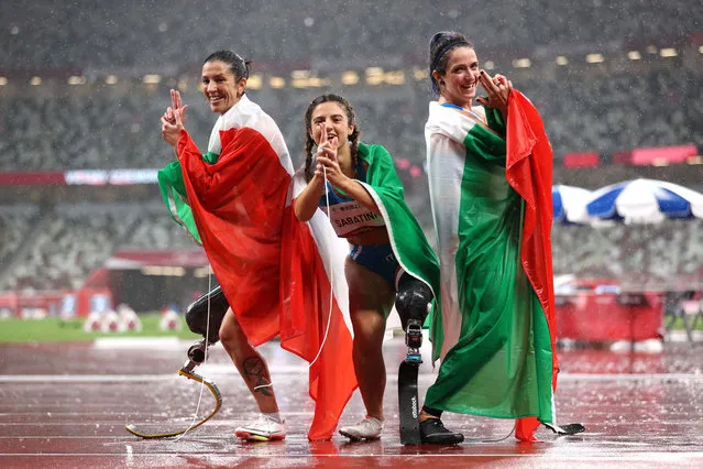 Bronze medalist Monica Graziana Contrafatto of Team Italy, gold medalist Ambra Sabatini of Team Italy and silver medalist Martina Caironi of Team Italy celebrate after competing in the Women's 100m - T63 Final  on day 11 of the Tokyo 2020 Paralympic Games at Olympic Stadium on September 04, 2021 in Tokyo, Japan. (Photo by Alex Pantling/Getty Images)