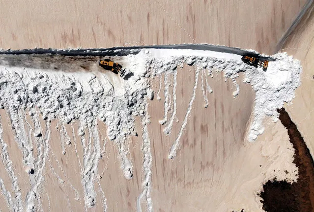 An aerial view of snow covered mountainous road, about 3,000 meters altitude, as snow removal teams try to open the village roads in the north of Aydintepe district of Bayburt, Turkiye on April 25, 2022. The snow-fighting teams of the Special Provincial Administration continue their efforts to reach the settlements whose roads are closed due to snow for 6 months of the year in Bayburt, where the winter season lasts tough and the snow thickness reaching a height of meters. (Photo by Besir Kelleci/Anadolu Agency via Getty Images)