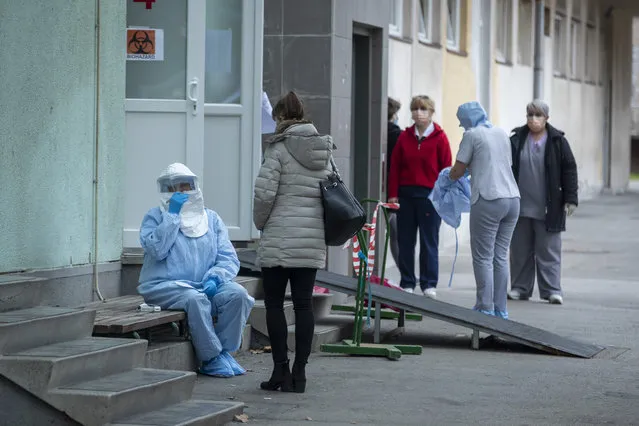 A health worker takes notes at the infectious disease clinic in Zagreb, Croatia, where the first coronavirus case in Croatia is hospitalized, Tuesday, February 25, 2020. Croatia confirmed its first case of coronavirus in a man who had been to Milan, the capital of Lombardy, Italy. (Photo by Darko Bandic/AP Photo)