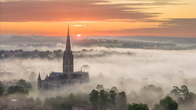 Salisbury Cathedral shrouded in the early morning mist on August 7, 2024. Weather maps of Britain have shown the rain front approaching the UK while the Met Office has issued warnings of possible thunderstorms. (Photo by South West News Service)