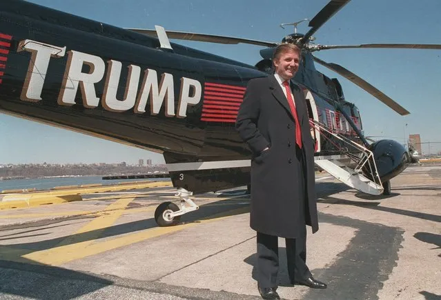 In this March 1988, file photo, Donald Trump stands next to one of his three Sikorsky helicopters at New York Port Authority's West 30 Street Heliport. (Photo by Wilbur Funches/AP Photo)