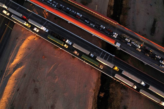 A drone view shows trucks waiting in line at the Zaragoza-Ysleta border crossing bridge to cross into the U.S., in Ciudad Juarez, Mexico on November 26, 2024. (Photo by Jose Luis Gonzalez/Reuters)