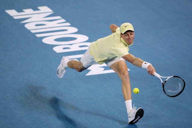 Jannik Sinner of Italy plays a backhand return to Alex de Minaur of Australia during their quarterfinal match at the Australian Open tennis championship in Melbourne, Australia, Wednesday, January 22, 2025. (Photo by Ng Han Guan/AP Photo)