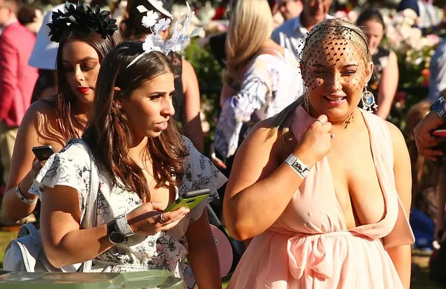 Racegoers enjoy the atmosphere following 2017 Stakes Day at Flemington Racecourse on November 11, 2017 in Melbourne, Australia. (Photo by Scott Barbour/Getty Images)