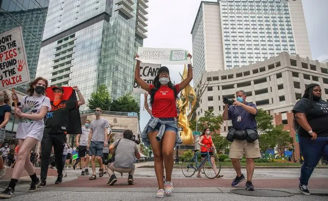Marchers march as part of a Juneteenth Celebration on June 19, 2020 in Baltimore, Maryland. Juneteenth commemorates June 19, 1865, when a Union general read orders in Galveston, Texas stating all enslaved people in Texas were free according to federal law. (Photo by J. Countess/Getty Images)