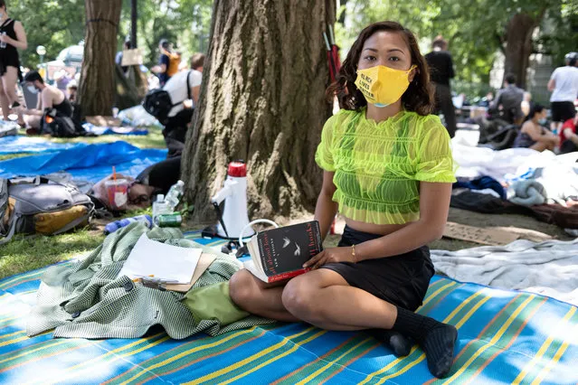 Liana Rebollos, 23, who has been protesting for months, slept in the park last night in support of defunding the NYPD on June 24, 2020. People have occupied City Hall Park calling for funding cuts to the NYPD. (Photo by Stephen Yang/The New York Post)