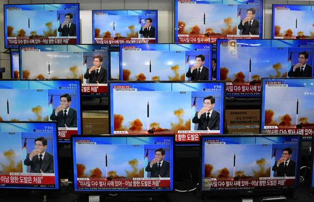 Television screens show a news report about the latest North Korean missile launch with file footage of a North Korean missile test, at an electronic market in Seoul on November 3, 2022. North Korea fired one long-range and two short-range ballistic missiles on November 3, Seoul's military said, with one prompting warnings for residents of a South Korean island and people in parts of northern Japan to seek shelter. (Photo by Jung Yeon-je/AFP Photo)