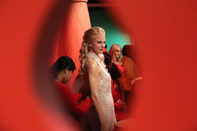 An Indian museum's official retouches a wax figure of Australian actress Nicole Kidman at the Madame Tussauds wax museum in New Delhi, India, 30 November 2017. The wax museum will be open for the visitors from 01 December on. Madame Tussauds New Delhi features 50 wax figures of personalities from the fields of sports, music, film, history and politics. (Photo by Rajat Gupta/EPA/EFE)