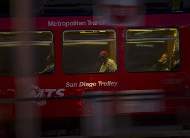 Passengers travel towards San Diego in a street trolley as they leave the border town of San Ysidro, California September 2, 2015. (Photo by Mike Blake/Reuters)