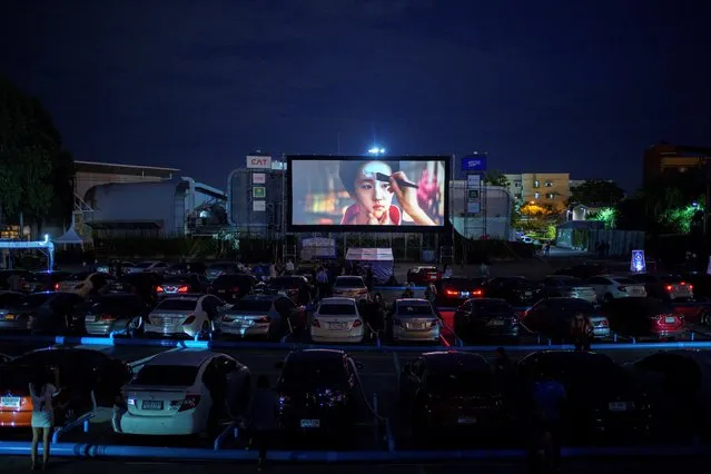 Vehicles are parked at the first drive-in movie theatre for people to enjoy movies while keeping social distancing amid the spread of the coronavirus disease (COVID-19) in Bangkok, Thailand, July 2, 2020. (Photo by Athit Perawongmetha/Reuters)