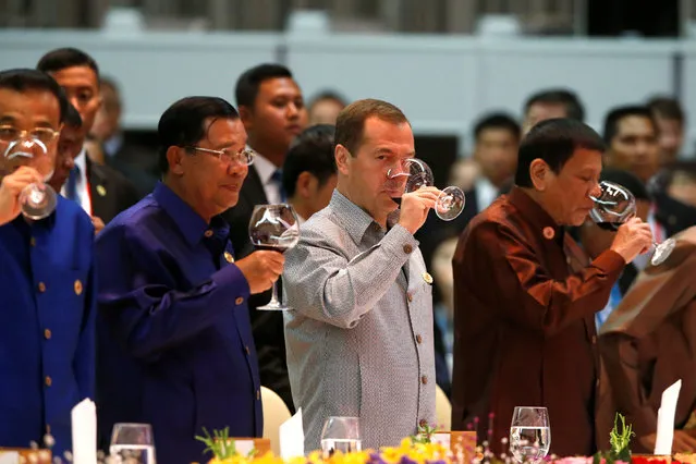 China's Premier Li Keqiang, Cambodia's Prime Minister Hun Sen, Russia's Prime Minister Dmitry Medvedev and Philippine President Rodrigo Duterte raise their glasses at the opening toast of the ASEAN Summit gala dinner in Vientiane, Laos September 7, 2016. (Photo by Jonathan Ernst/Reuters)