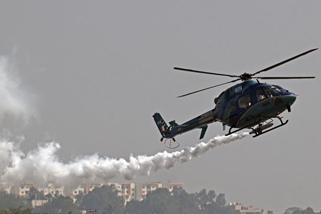 The Indian Air Force (IAF) HAL light utility helicopter performs during the inaugural day of the 15th edition of 'Aero India 2025', a military aviation exhibition at the Yelahanka Air Force Station in Bengaluru on February 10, 2025. (Photo by Idrees Mohammed/AFP Photo)