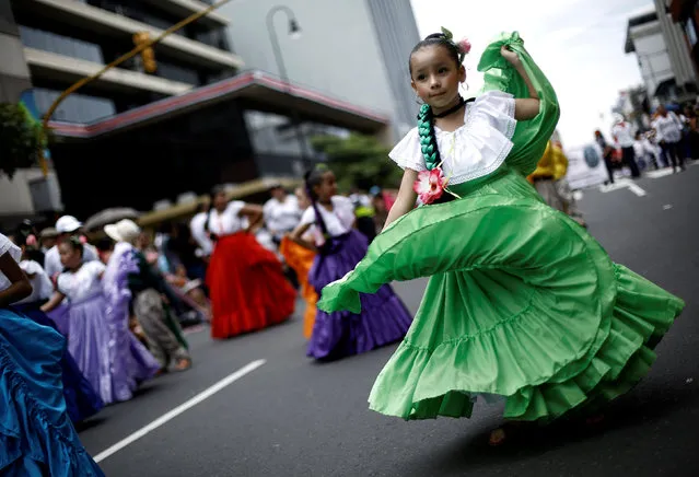 Schoolchildren wearing traditional dress dance during a parade commemorating Costa Rica's Independence Day in San Jose, Costa Rica, September 15, 2016. (Photo by Juan Carlos Ulate/Reuters)
