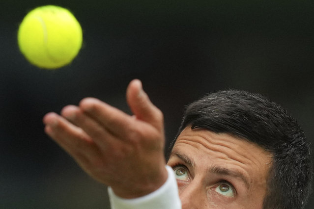Novak Djokovic of Serbia serves to Miomir Kecmanovic of Serbia during a third round men's singles match at the Wimbledon Tennis Championships in London, Saturday, July 5, 2025. (Photo by Kirsty Wigglesworth/AP Photo)